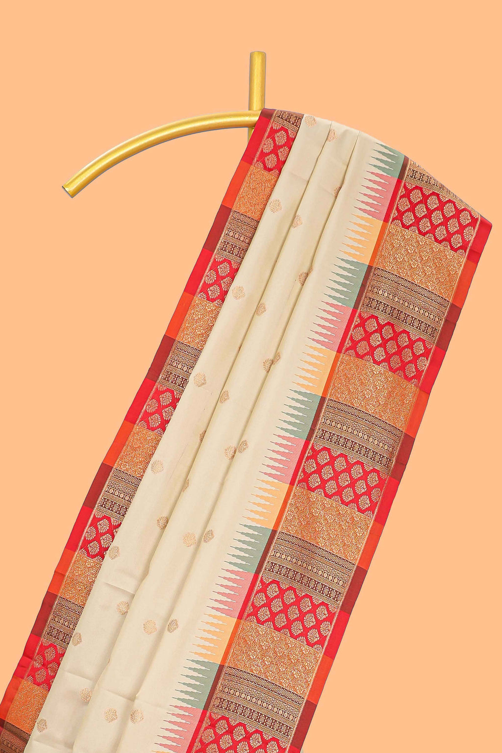 Cream zari butta designed semi soft silk saree with contrast red and gold geometric and floral pattern border and blouse