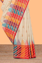 Cream zari butta designed semi soft silk saree with contrast multicolor and zari designed border and blouse