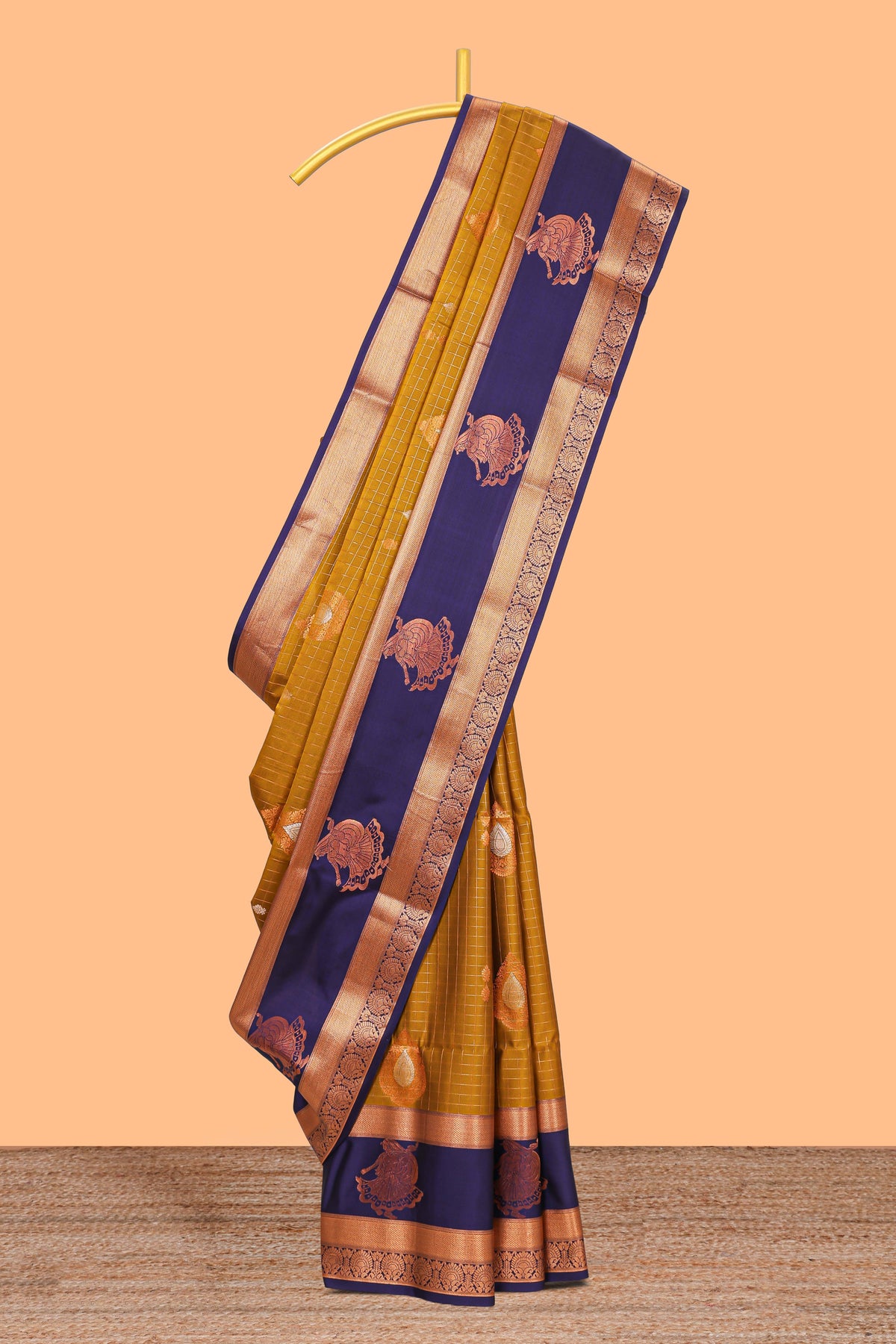 Mustard gold checked and floral motifs semi soft silk saree with contrast pavai motifs border and blouse