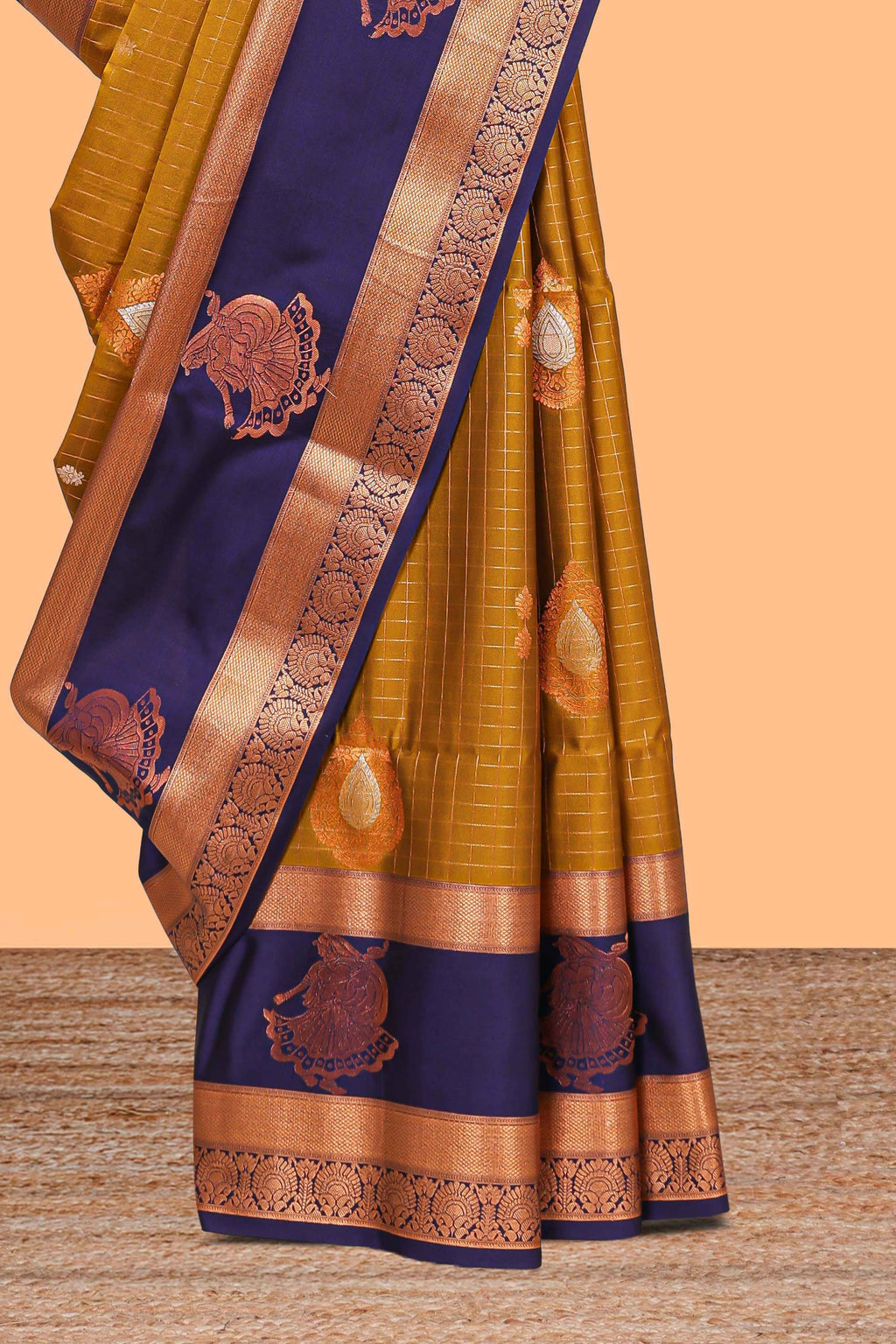 Mustard gold checked and floral motifs semi soft silk saree with contrast pavai motifs border and blouse
