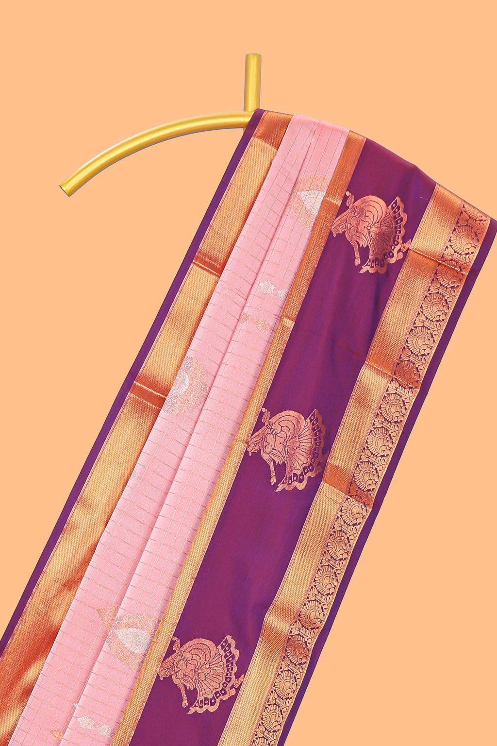 Light pink checked and floral motifs semi soft silk saree with contrast pavai motifs border and blouse