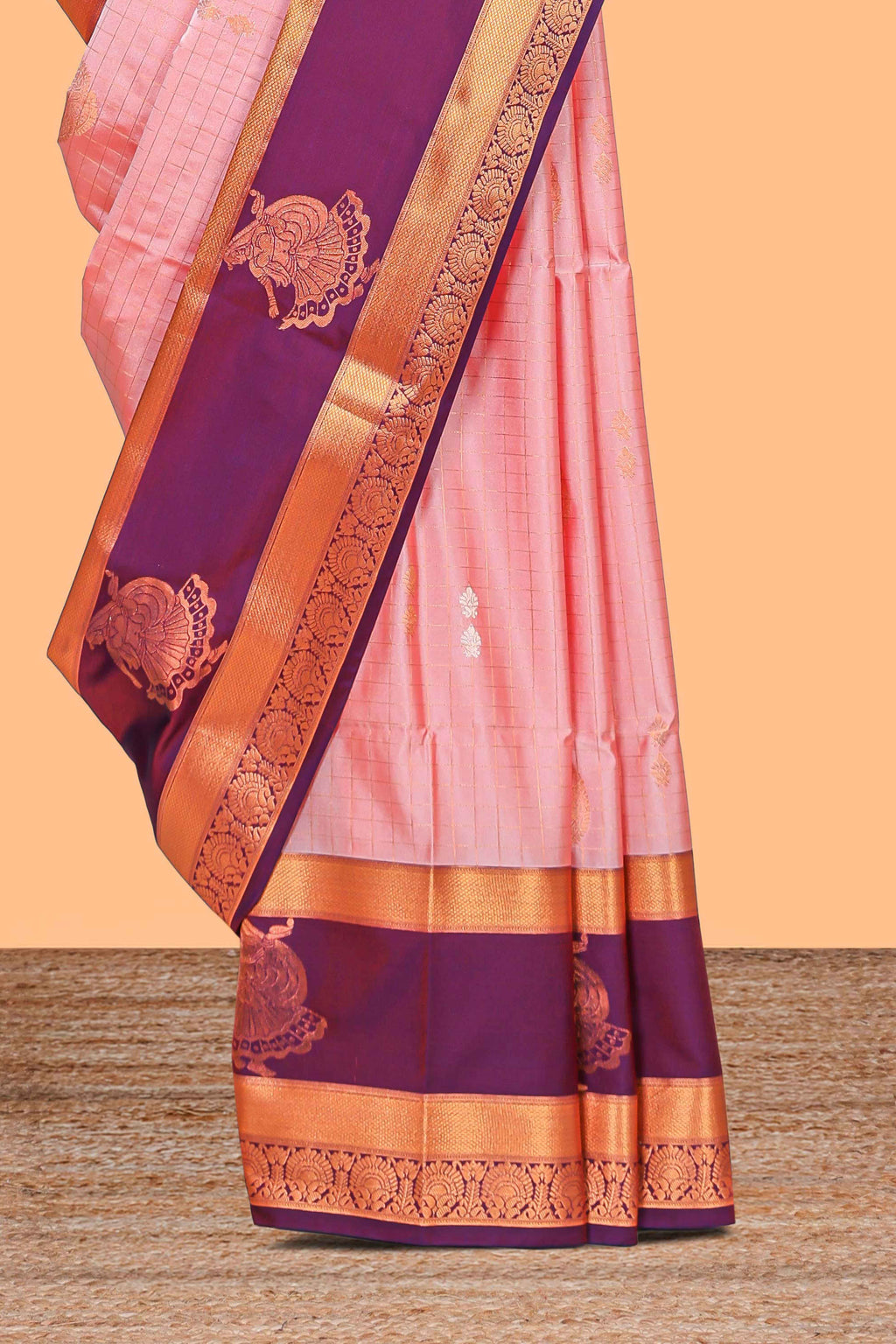 Light pink checked and floral motifs semi soft silk saree with contrast pavai motifs border and blouse