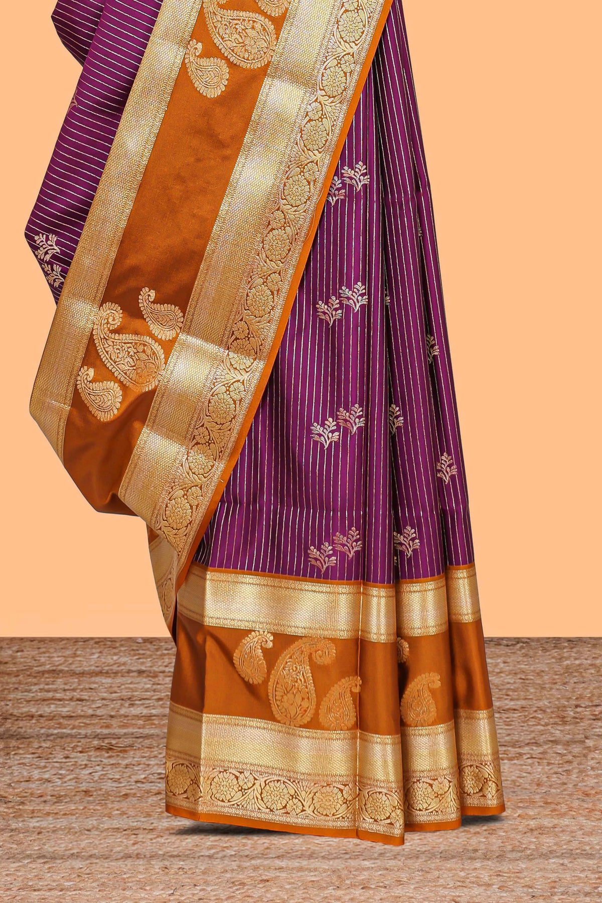 Magenta-purple striped and leafy motifs semi soft silk saree with contrast zari manga motifs border and blouse