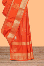 Bright orange checked and butta designed semi soft silk saree with self zari pavai motifs border and blouse