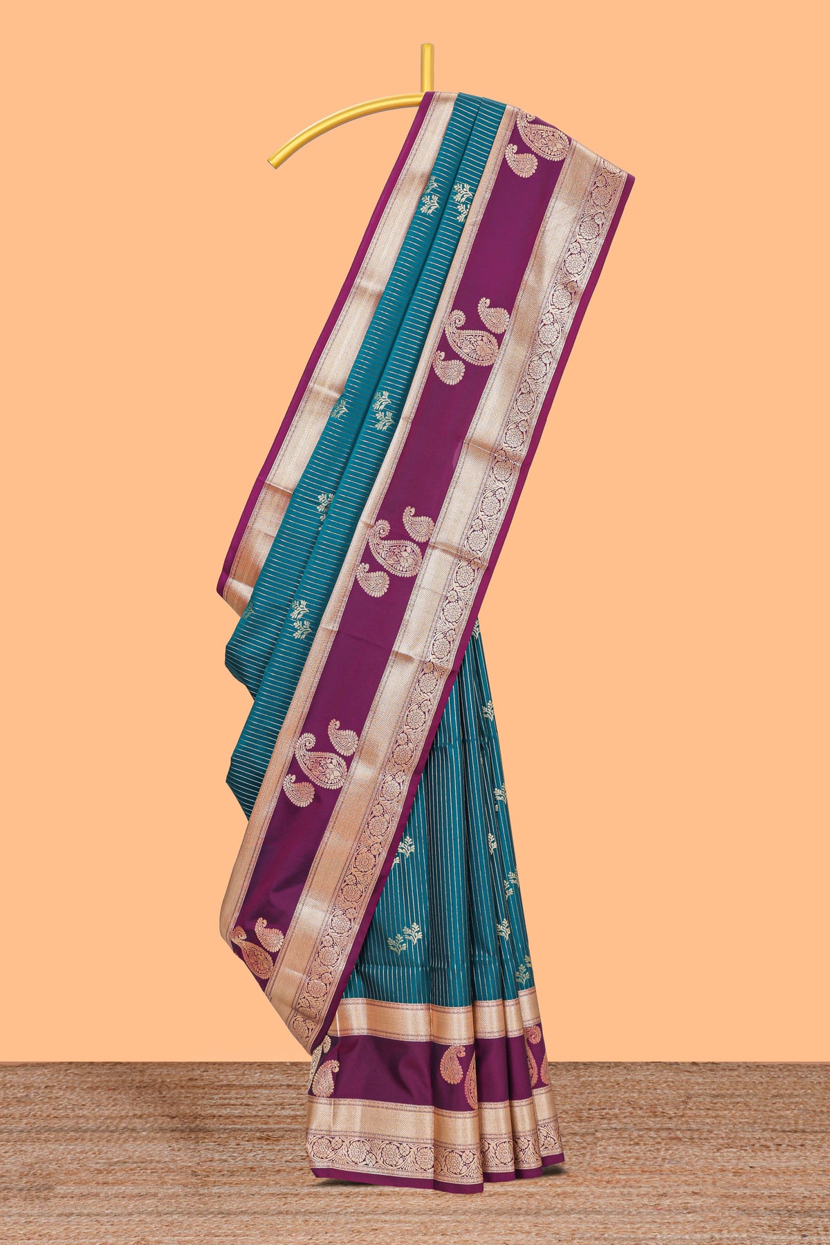 Teal-peacock blue striped and leafy motifs semi soft silk saree with contrast zari manga motifs border and blouse