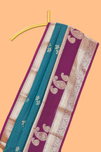Teal-peacock blue striped and leafy motifs semi soft silk saree with contrast zari manga motifs border and blouse