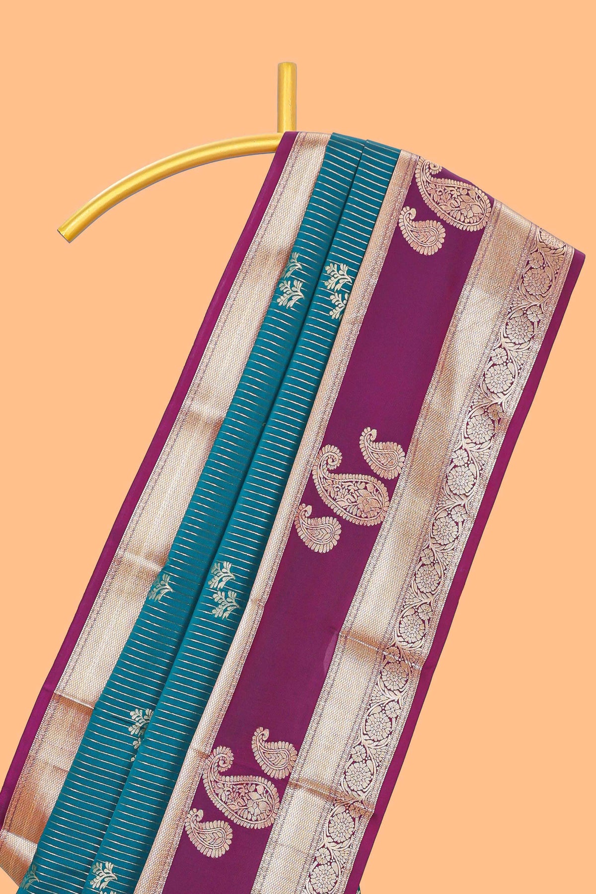 Teal-peacock blue striped and leafy motifs semi soft silk saree with contrast zari manga motifs border and blouse