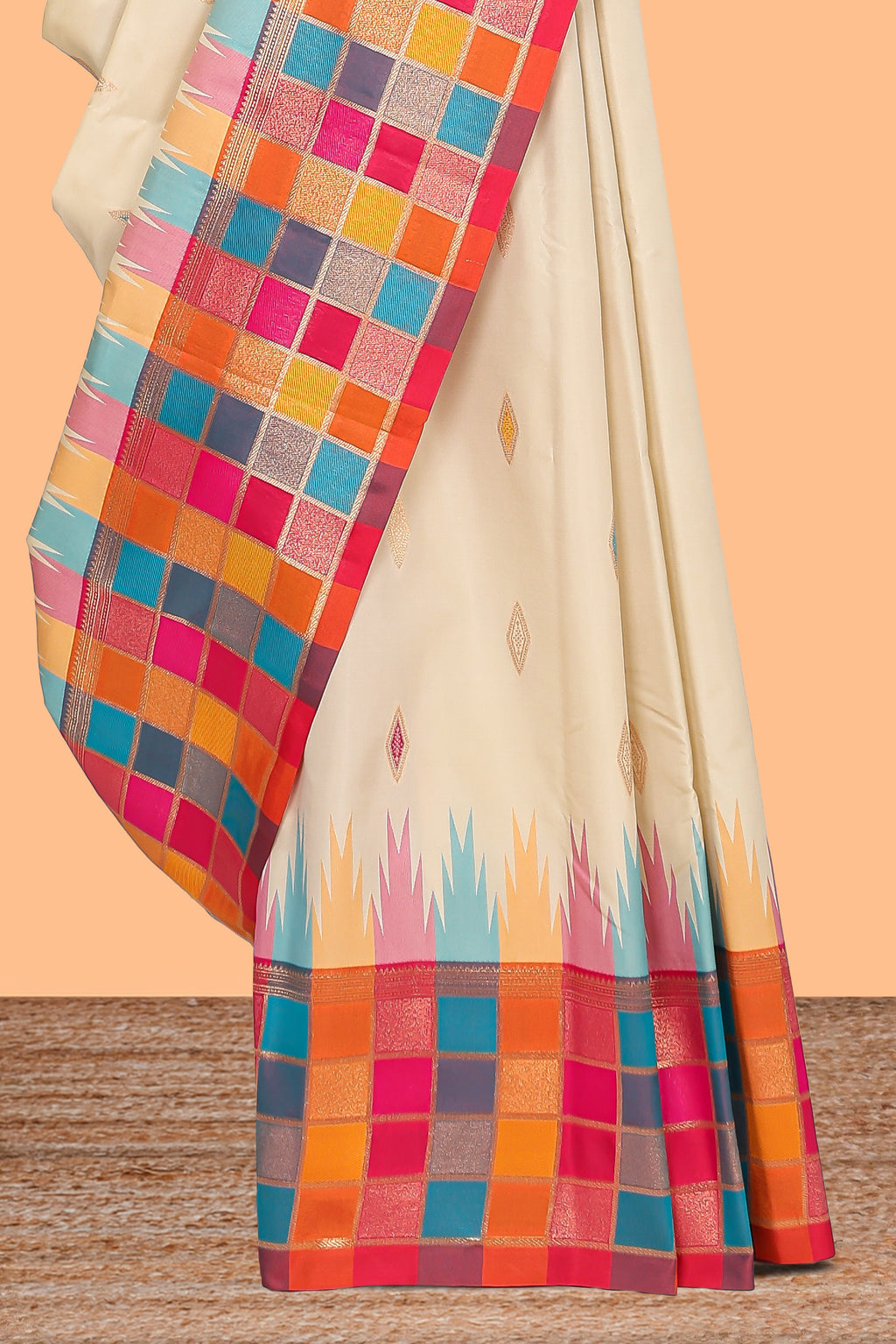 Cream geometric motifs semi soft silk saree with contrast multicolor checked border and blouse