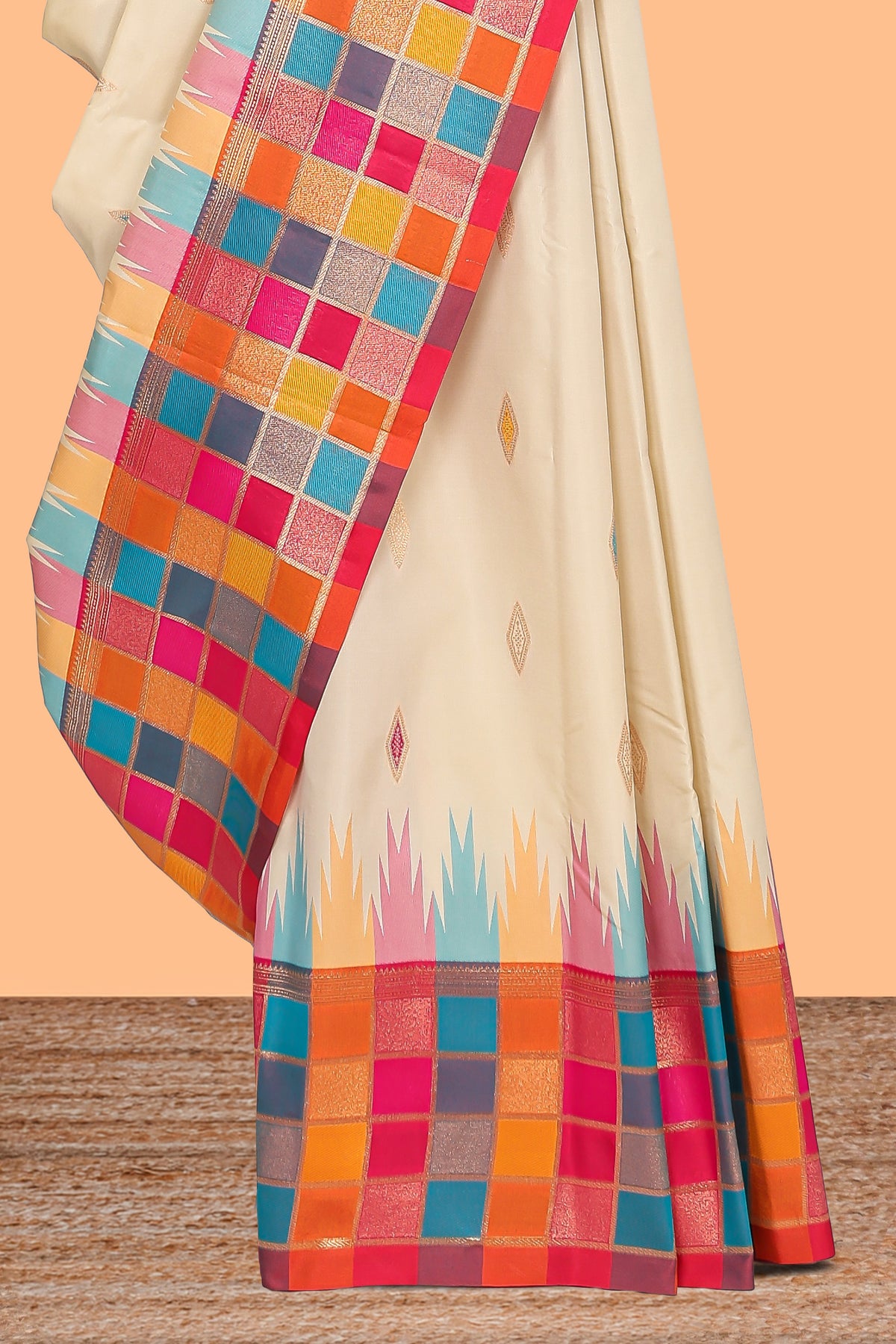 Cream geometric motifs semi soft silk saree with contrast multicolor checked border and blouse