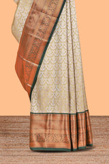 Powder Yellow Tissue Silk Saree with Antique Gold Zari Weaving and Contrast Border along with Contrast Blouse