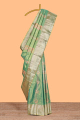 Pastel Green Tissue Silk Saree with Zari Weaving and PastelFloral Accents along with Matching Blouse