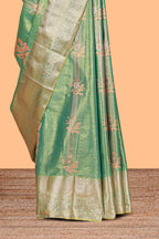 Pastel Green Tissue Silk Saree with Zari Weaving and Pastel  Floral Accents along with Matching Blouse