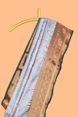 Pastel Aqua Blue Tissue Silk Saree with Antique Gold Zari Weaving and Contrast Dark Green Border along with Matching Blouse