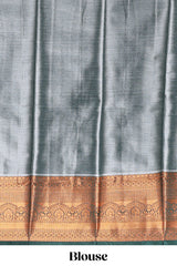 Pastel Aqua Blue Tissue Silk Saree with Antique Gold Zari Weaving and Contrast Dark Green Border along with Matching Blouse