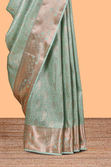 Pastel Green Color Tissue Silk Saree withZari Weaving Body and Contrast Border along with Matching Blouse