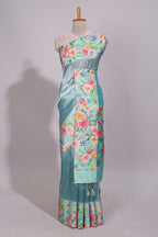 Blue geometric design tissue saree with contrast floral print border and printed blouse