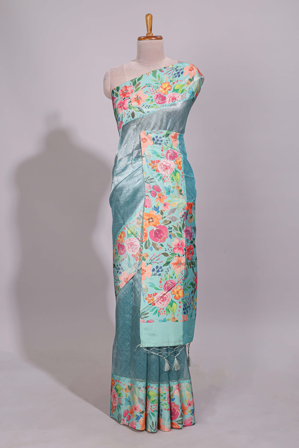 Blue geometric design tissue saree with contrast floral print border and printed blouse