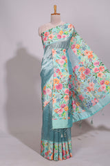 Blue geometric design tissue saree with contrast floral print border and printed blouse