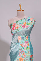 Blue geometric design tissue saree with contrast floral print border and printed blouse