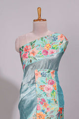 Blue geometric design tissue saree with contrast floral print border and printed blouse