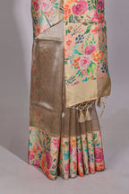 Brown geometric design tissue saree with contrast floral print border and printed blouse