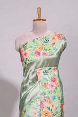 Green geometric design tissue saree with contrast floral print border and printed blouse