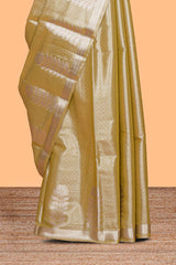 Mustard zari floral design tissue saree with self zari border and matching blouse