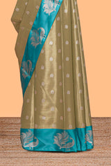 Mustard zari motifs design tissue saree with contrast peacock zari border and motifs blouse