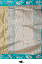 Mustard zari motifs design tissue saree with contrast peacock zari border and motifs blouse