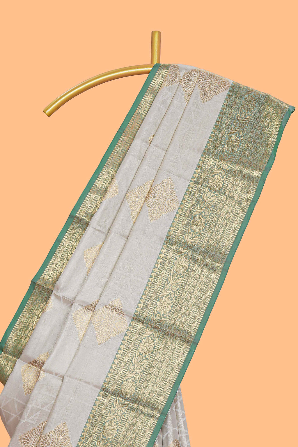 Grey zari motifs design tissue saree with contrast zari border and zari blouse