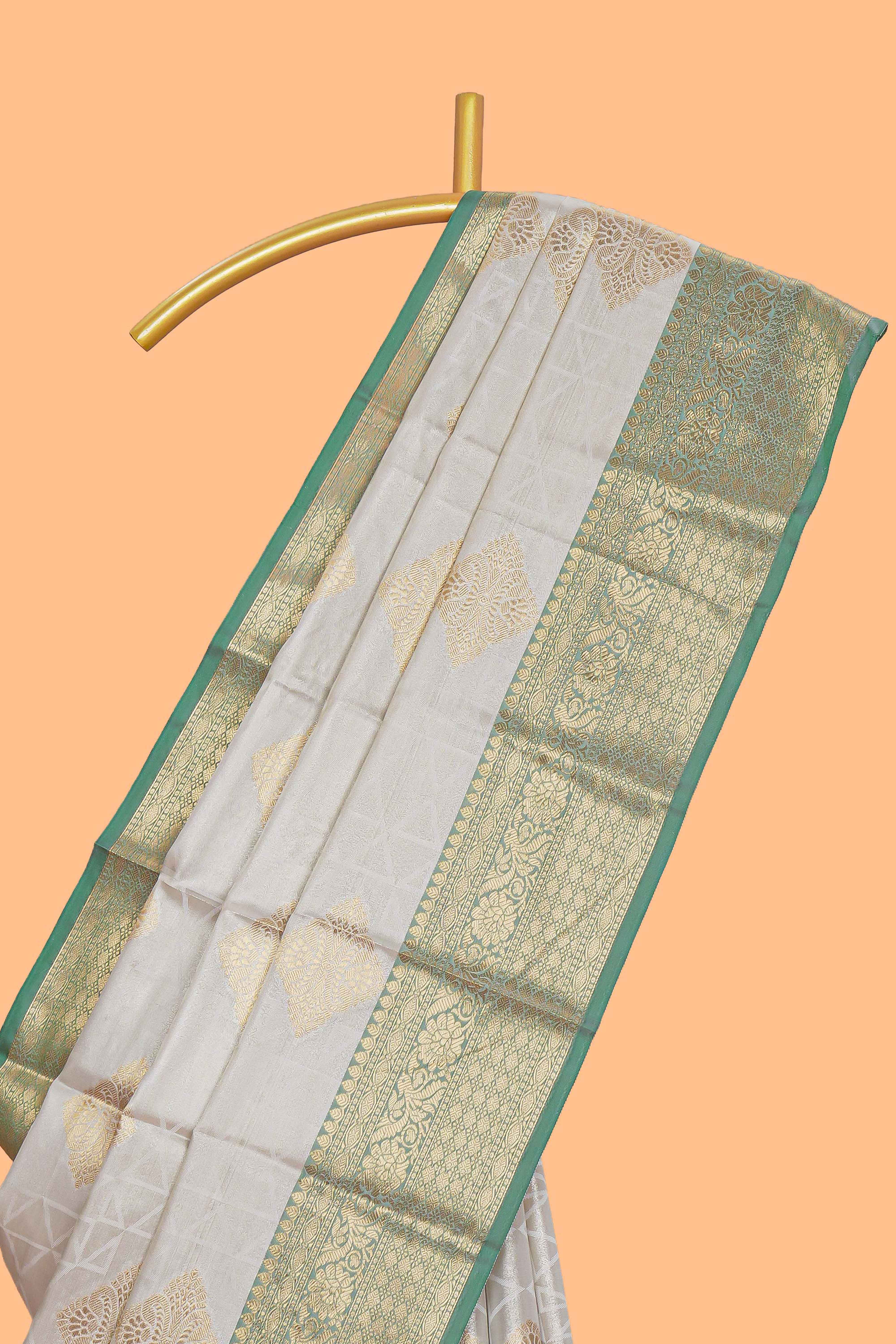Grey zari motifs design tissue saree with contrast zari border and zari blouse