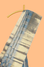 Blue checked zari motifs art tissue saree with self zari border and matching blouse