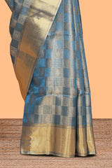 Blue checked zari motifs art tissue saree with self zari border and matching blouse
