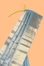 Blue geometric zari motifs art tissue saree with self zari border and matching blouse