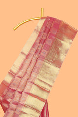 Pink checked zari motifs art tissue saree with self zari border and matching blouse