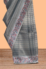 Multi color striped art tissue saree with contrast border and plain blouse
