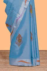 Blue peacock feather design tissue saree with self zari border and contrast blouse