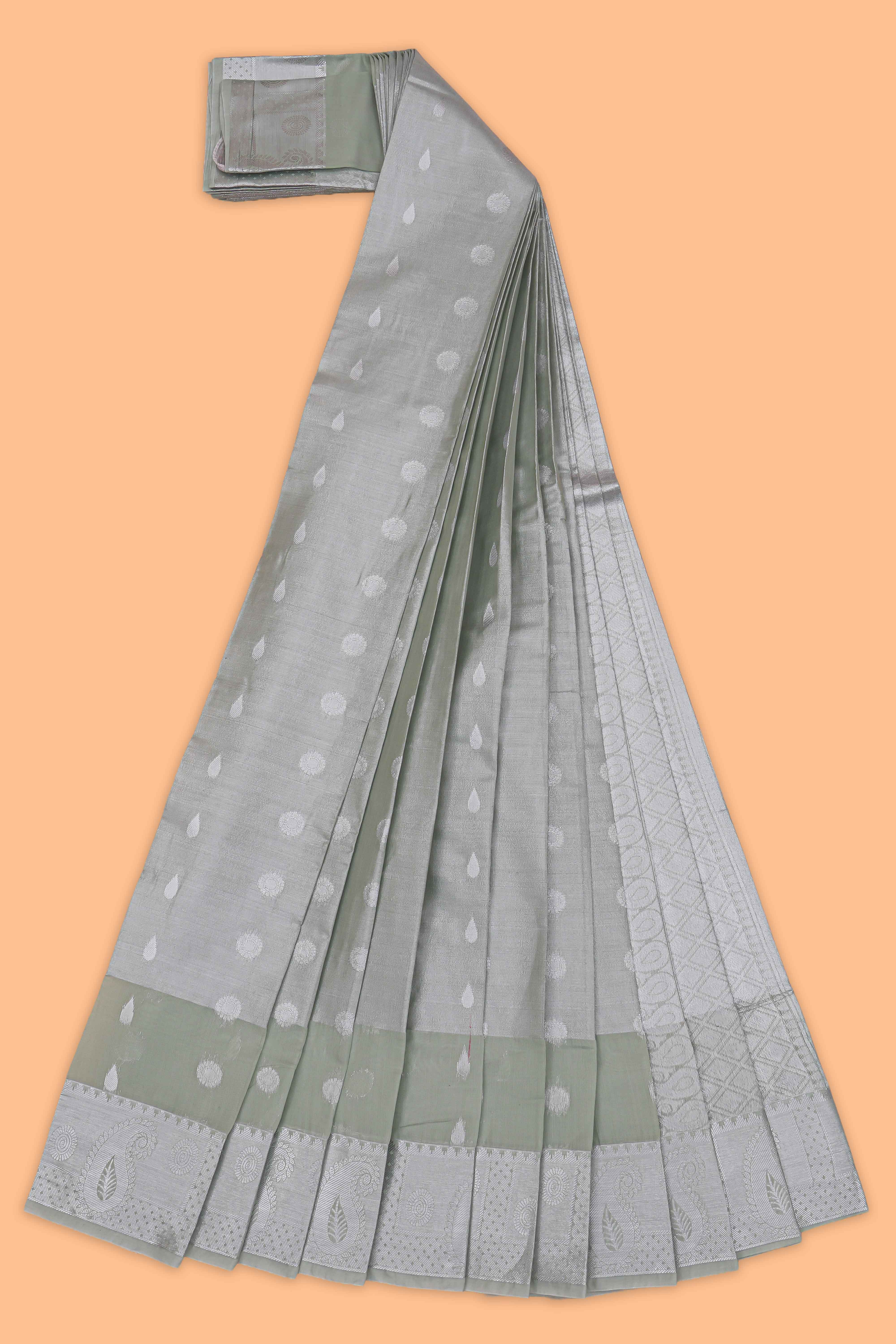 Green floral design art tissue saree with contrast border and matching blouse