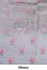 Grey striped design crush tissue saree with contrast floral border and matching blouse