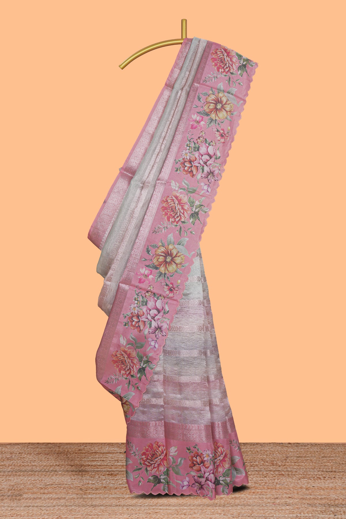 Peach striped design crush tissue saree with contrast floral border and matching blouse
