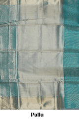 Teal blue geometric zari design art tissue saree with self zari border and matching blouse