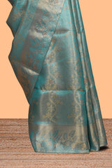 Teal blue floral vine zari design art tissue saree with self zari border and contrast blouse