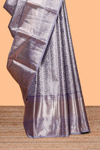 Lavender silver zari floral design art tissue saree with self zari border and matching blouse