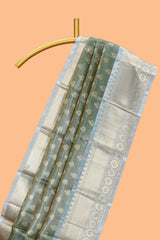 Sea green zari motifs design art tissue saree with contrast zari border and blouse