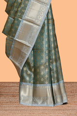 Sea green zari motifs design art tissue saree with contrast zari border and blouse