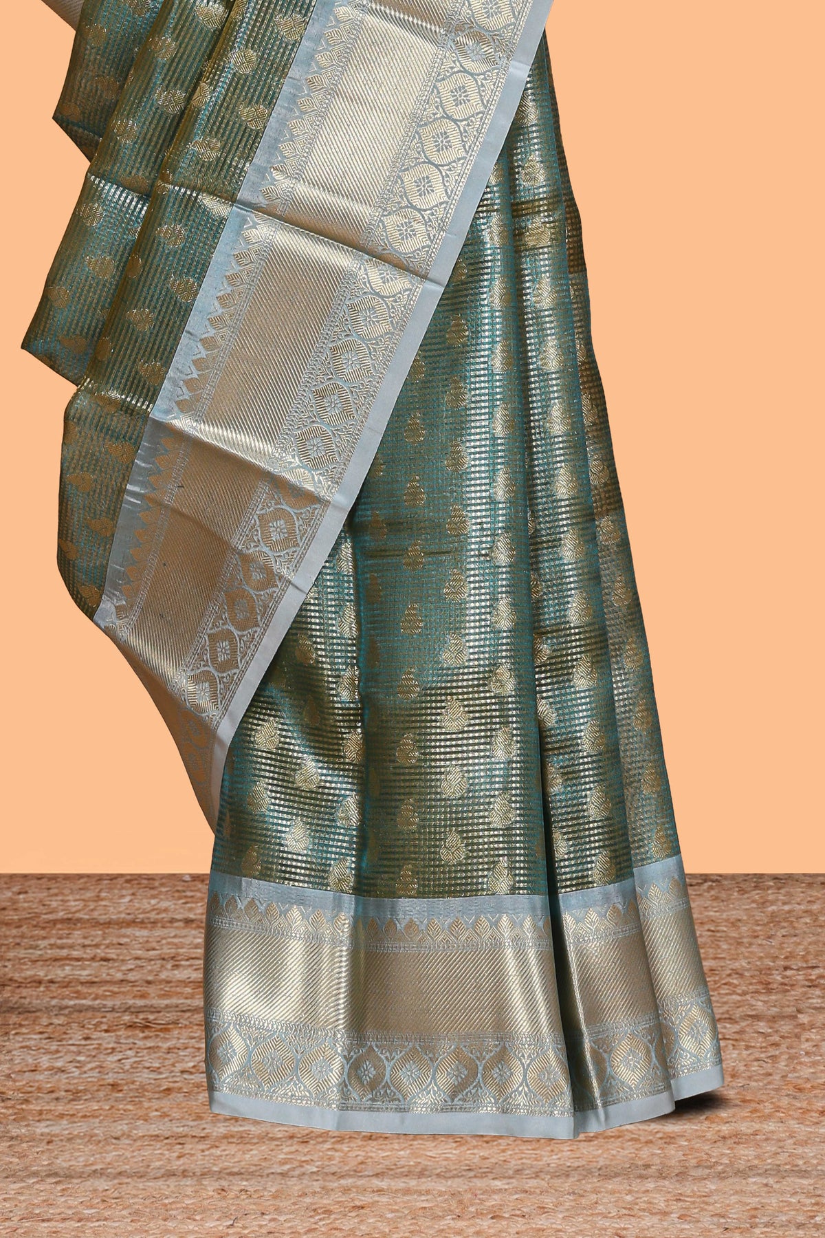 Sea green zari motifs design art tissue saree with contrast zari border and blouse
