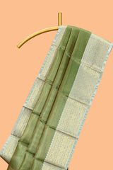 Green zari design art tissue saree with contrast zari border and motifs blouse