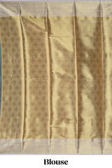 Green zari design art tissue saree with contrast zari border and motifs blouse