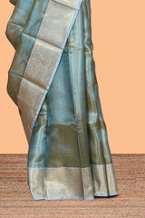 Blue zari design art tissue saree with self zari border and contrast motifs blouse