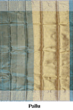 Blue zari design art tissue saree with self zari border and contrast motifs blouse